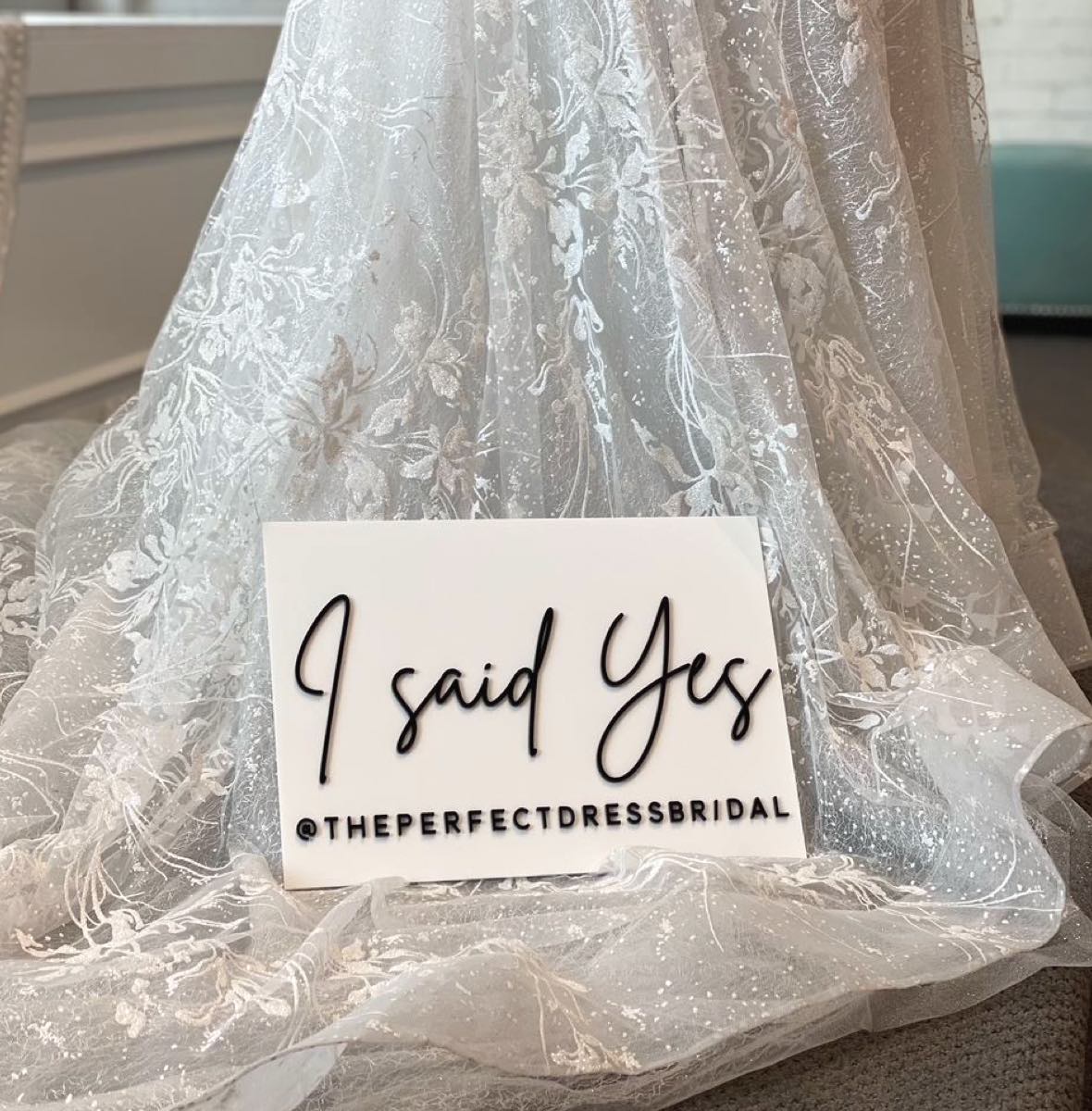 Photo of Wedding Dress and I Said Yes Sign at The Perfect Dress